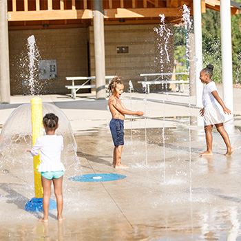 Kids play at the Burnes Park splash pad